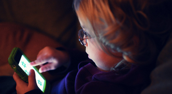 Photo of child using a phone